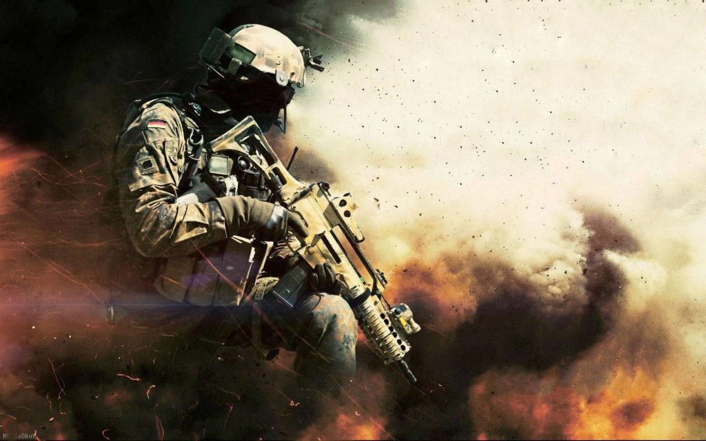 German soldier in tactical gear raising weapon on smoky war battlefield with sparks flying Wallpaper