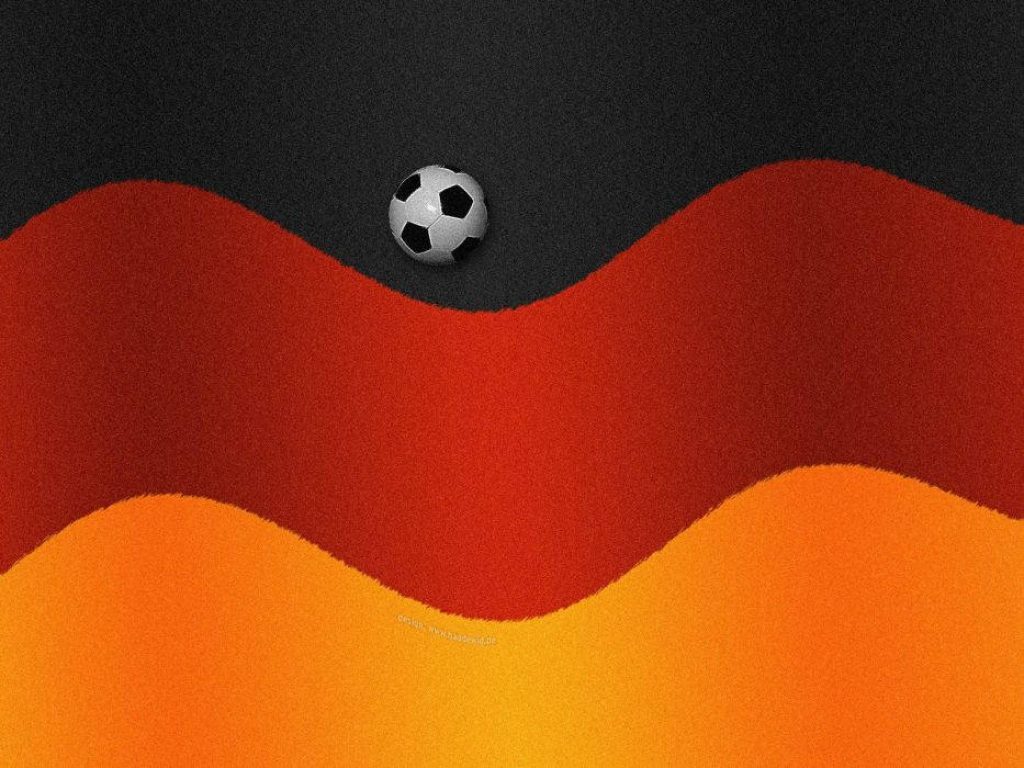 Germany National Football Team wallpaper with soccer ball on black red gold waves background
