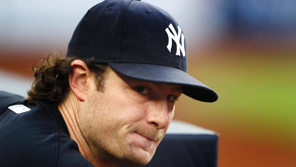 Gerrit Cole focused pitching in navy Yankees cap iconic lip-bite close-up baseball wallpaper