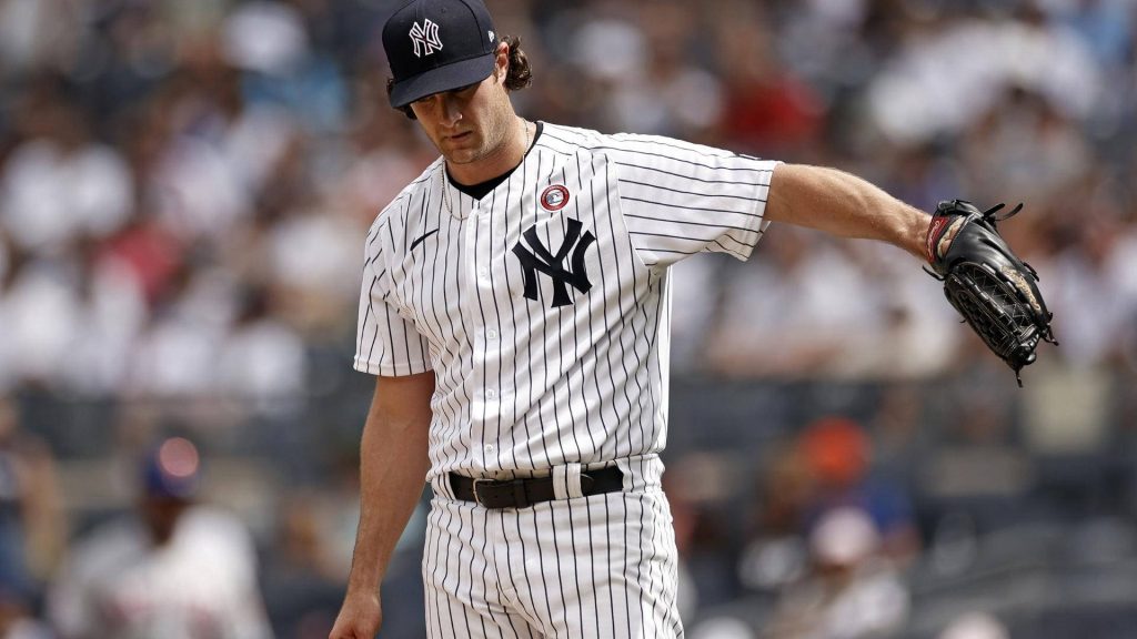 Gerrit Cole New York Yankees close-up in pinstripe uniform blurred stadium background wallpaper