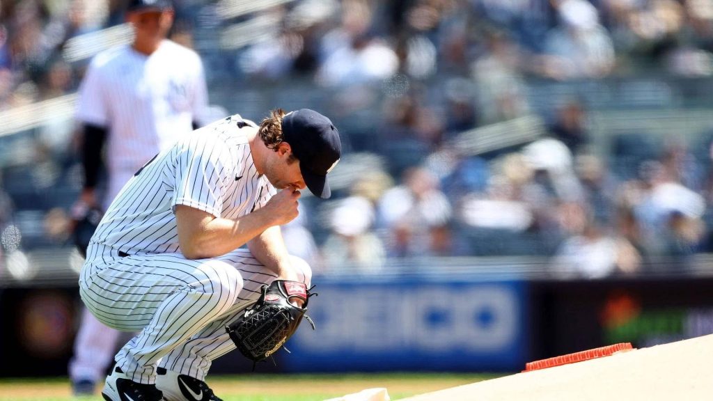 Gerrit Cole New York Yankees pitcher focused on mound in classic pinstripe uniform wallpaper