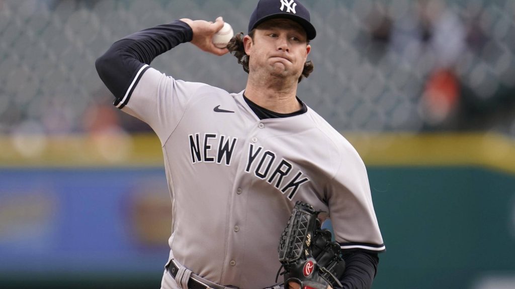 MLB action wallpaper featuring Gerrit Cole pitching in New York Yankees gray road uniform and cap