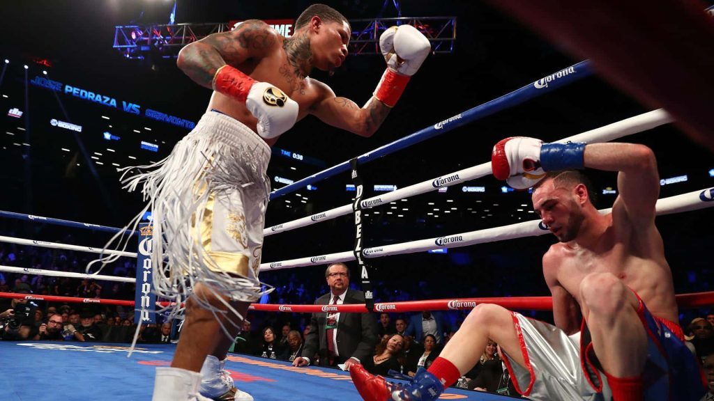 Gervonta Davis towering over José Pedraza in intense 2017 boxing championship fight wallpaper