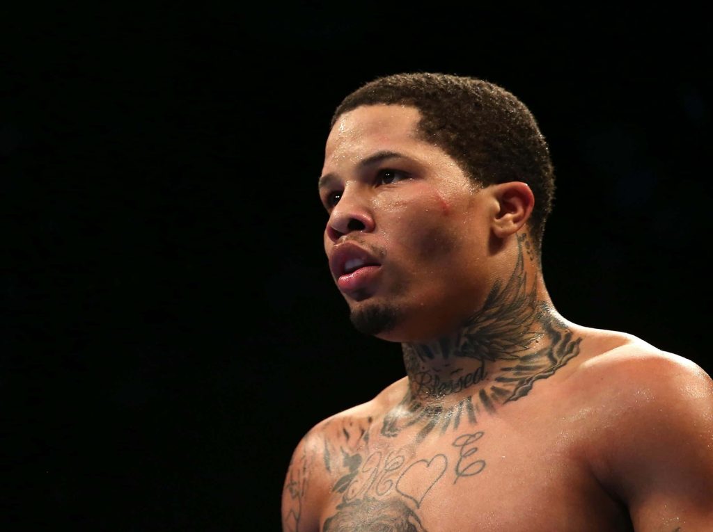 High-definition Gervonta Davis close-up with intense focused gaze and dramatic dark lighting background Wallpaper