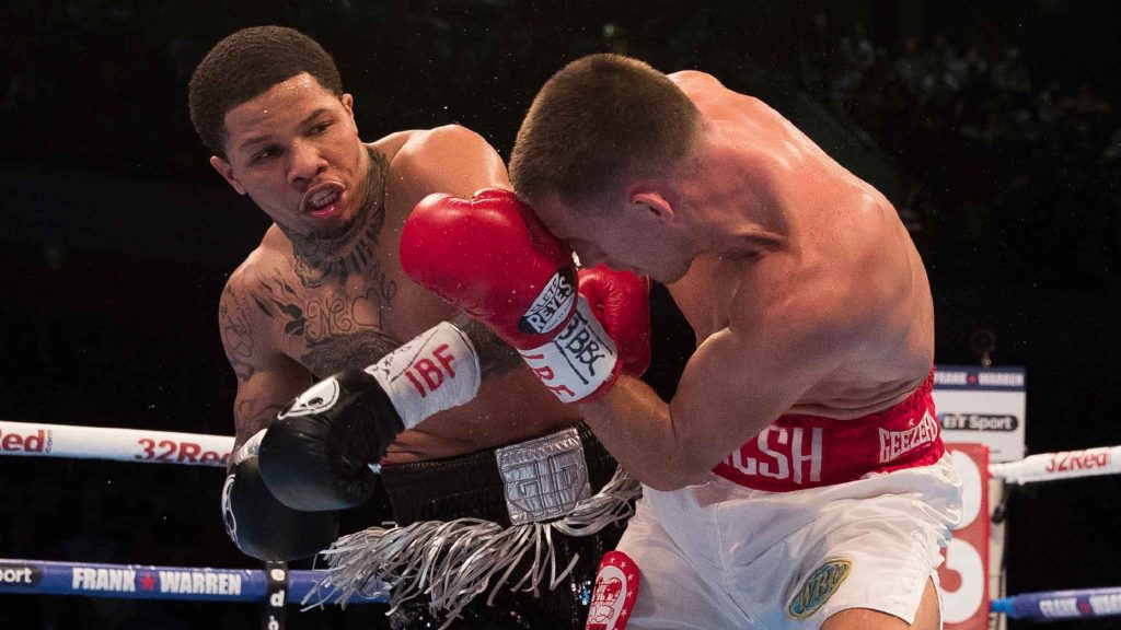 Gervonta Davis landing a powerful punch on Liam Walsh in intense professional boxing match wallpaper