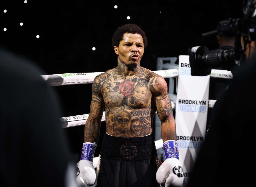 Gervonta Tank Davis shirtless in Brooklyn boxing ring showing tattoos and gear under bright lights Wallpaper