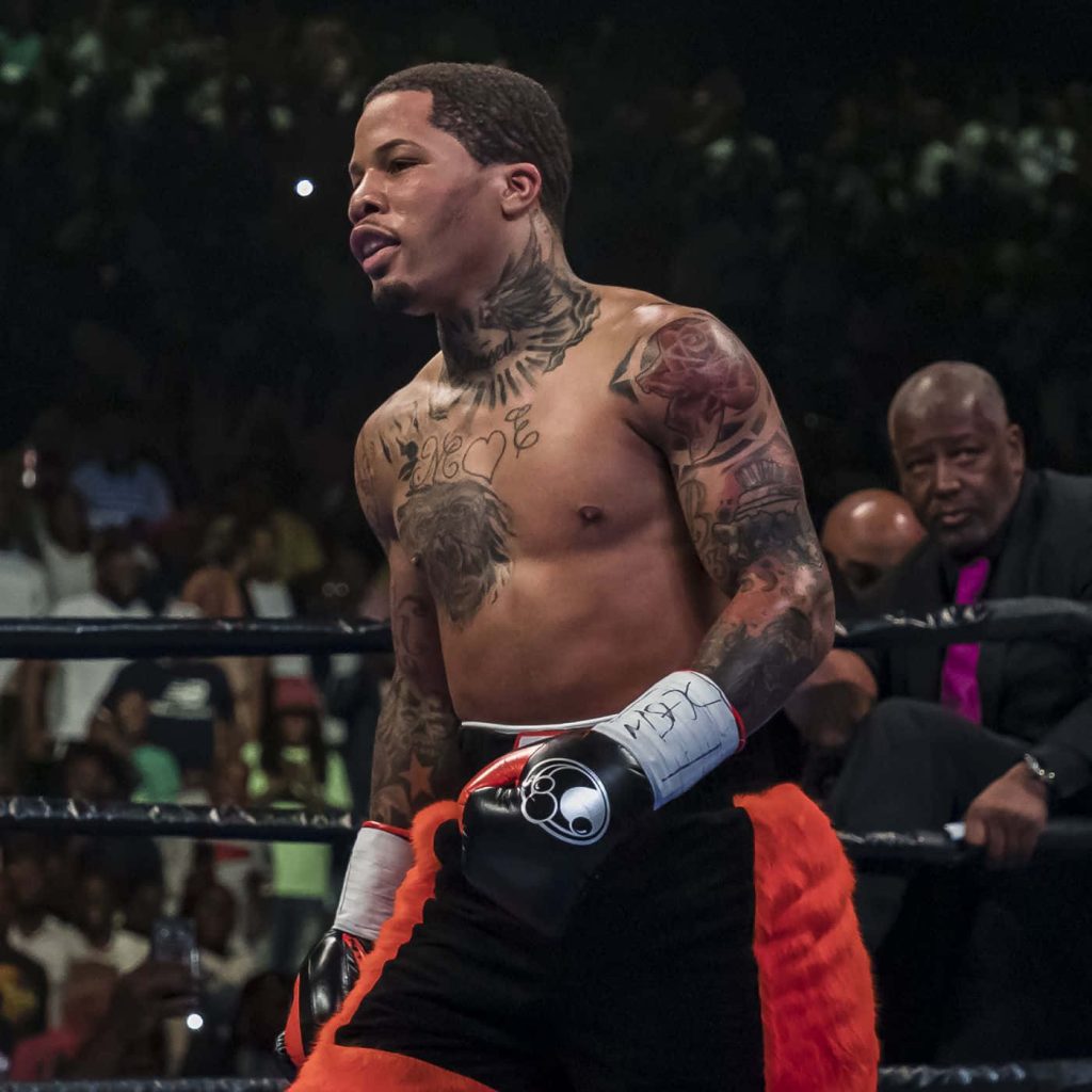 Gervonta Tank Davis boxing gloves vibrant orange shorts detailed tattoos intense ring focus wallpaper