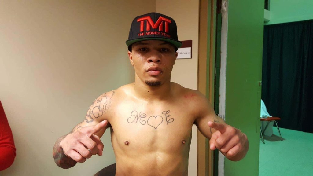 Gervonta Tank Davis shirtless locker room photo wearing black TMT cap pointing at camera Wallpaper