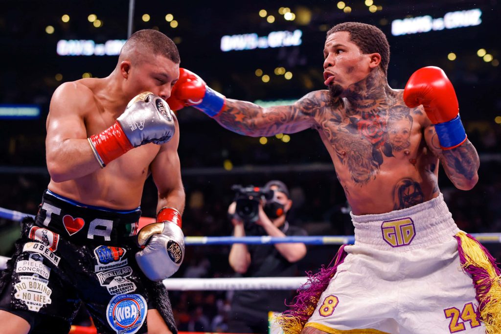 Gervonta Tank Davis lands powerful punch on Isaac Pitbull Cruz in intense boxing match wallpaper