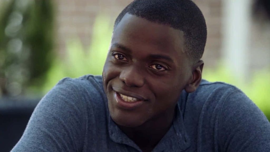 Daniel Kaluuya as Chris Washington smiling gently in Get Out outdoor film still wallpaper