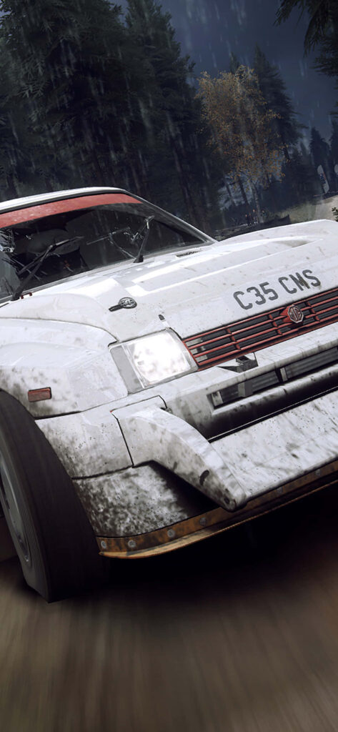 Intense dirt rally car covered in mud, forest speed blur - ideal wallpaper for motorsport fans