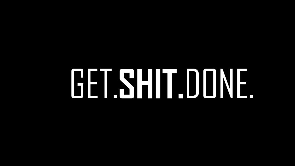 Minimalist black wallpaper with bold white GET SHIT DONE slogan for productivity and focus