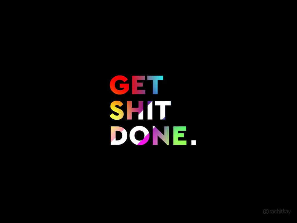 Minimalist wallpaper with bold multi-colored GET SHIT DONE text on deep black background for productivity