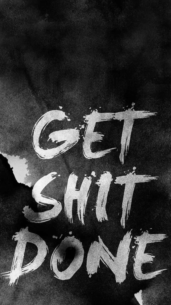 Bold Get Shit Done quote wallpaper with white scribble typography on dark textured background