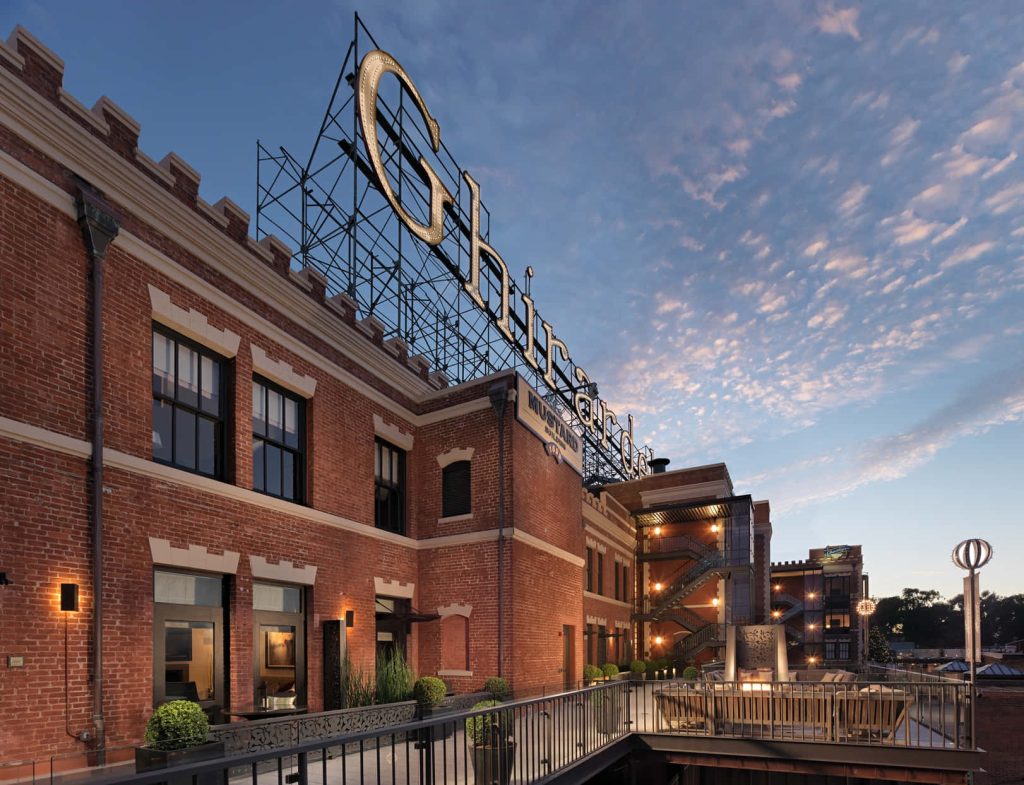 Ghirardelli Square San Francisco red brick buildings sunset with illuminated rooftop sign wallpaper