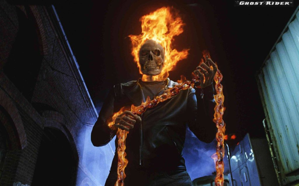 Ghost Rider HD wallpaper blazing flaming skull and chain against dark industrial night backdrop