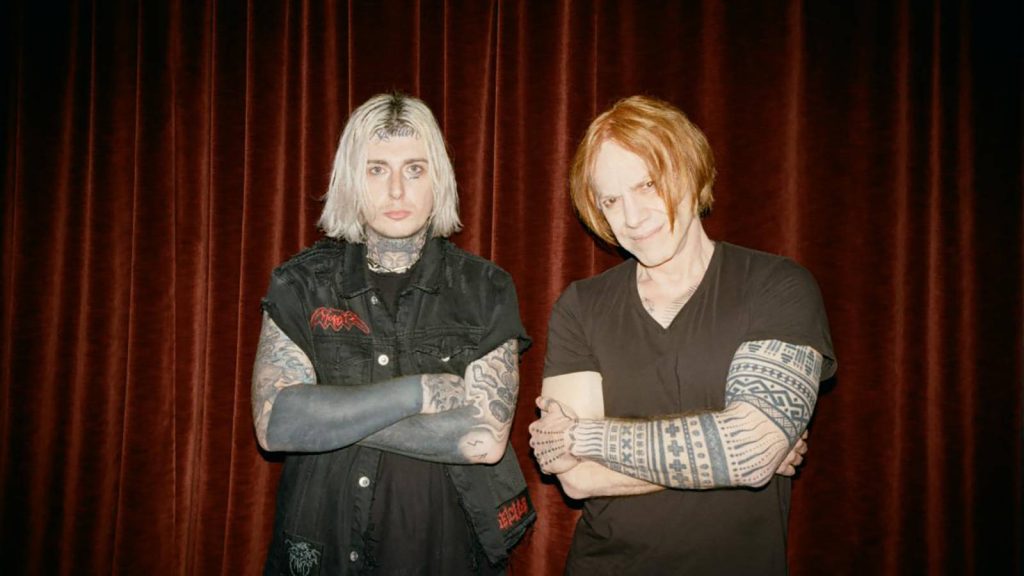 Ghostemane and Danny Elfman bold portrait with tattoos vivid red curtains edgy wallpaper background