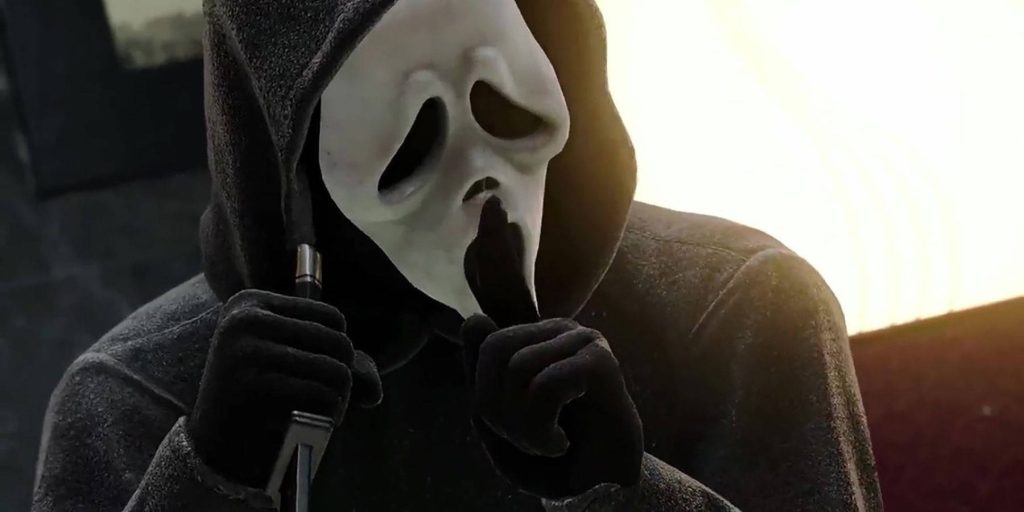 Ghostface from Scream franchise shushing in black cloak high contrast eerie profile wallpaper