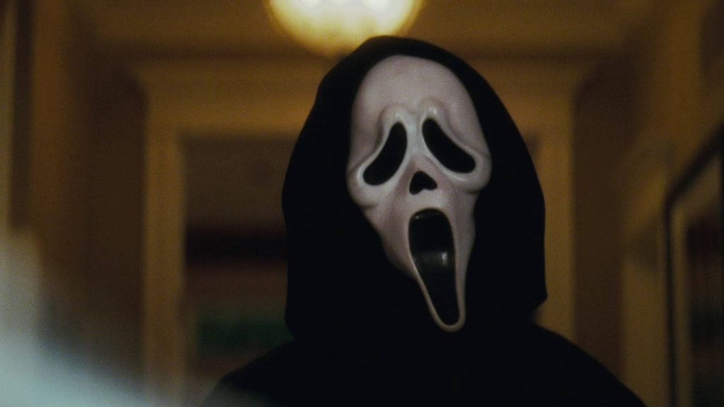 Close-up of Ghostface masked killer from Scream in black robe dark moody cinematic wallpaper