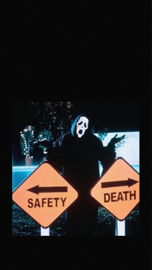 Ghostface from Scream behind yellow safety and death signs dark grunge Halloween wallpaper