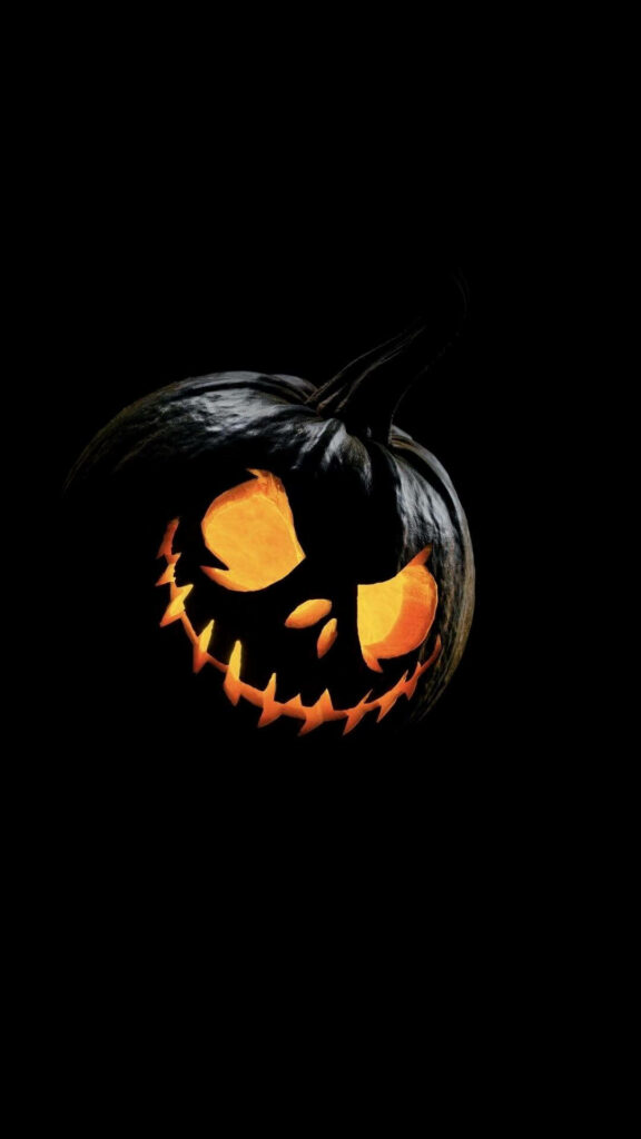 Ghoulishly Adorable Halloween Wallpaper: Ghostly Friend on Pumpkin Phone