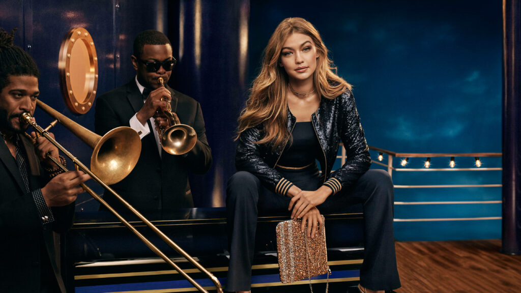Elegant Gigi Hadid in Tommy Hilfiger: Stylish Musical Wallpaper