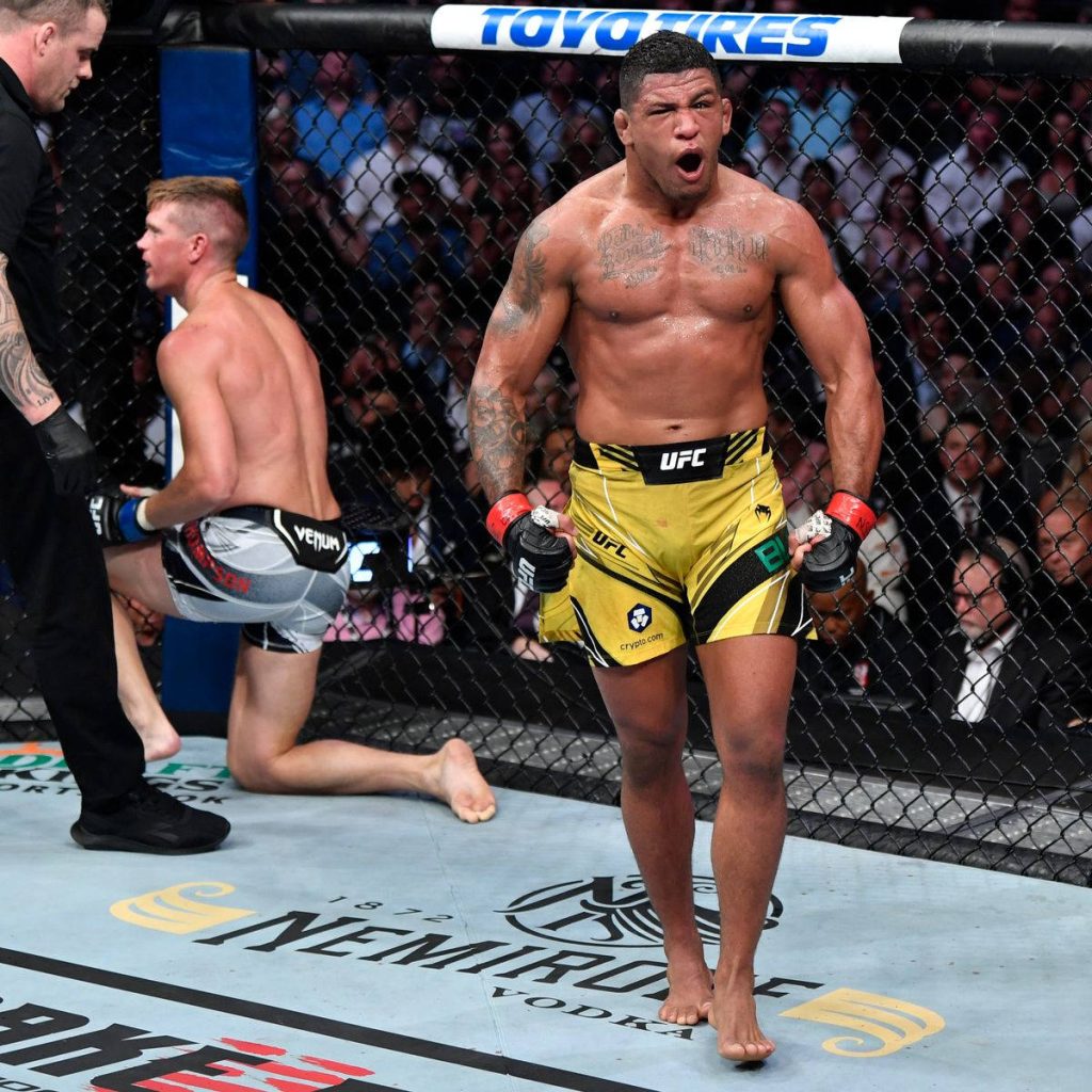 UFC fighter Gilbert Burns celebrates victory over Stephen Thompson in intense MMA fight Wallpaper
