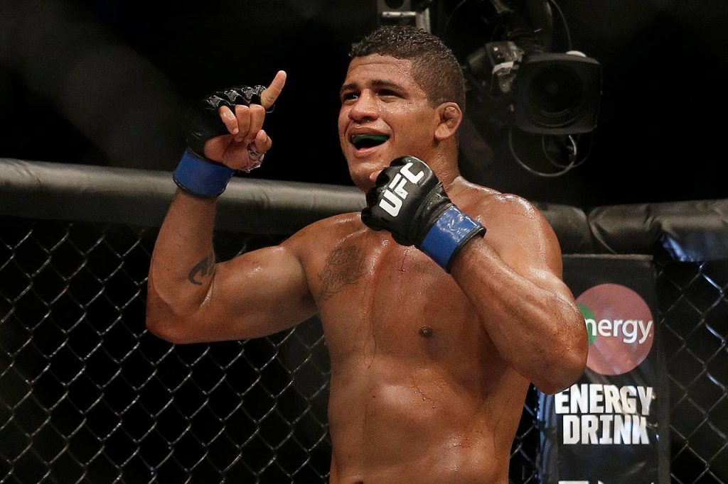 Gilbert Burns celebrating UFC victory over Andreas Stahl inside Octagon intense fight wallpaper