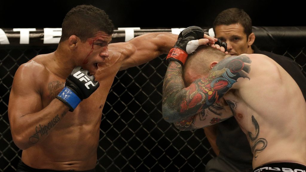 Gilbert Burns UFC fight intense MMA action controlling opponent in Octagon wallpaper background