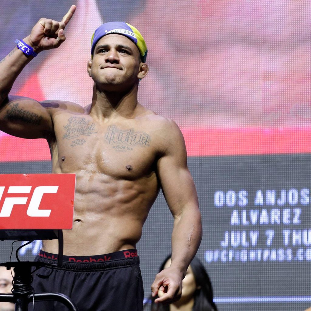 Gilbert Burns UFC weigh-in shirtless fighter intense focus vibrant red background MMA athlete Wallpaper
