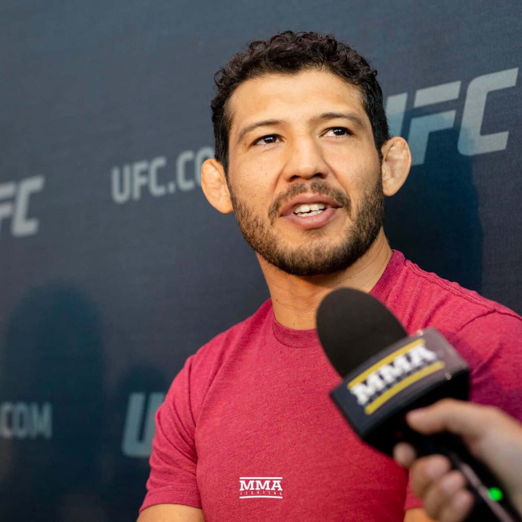 Gilbert Melendez MMA fighter in red shirt UFC interview MMA Fighting microphone wallpaper background