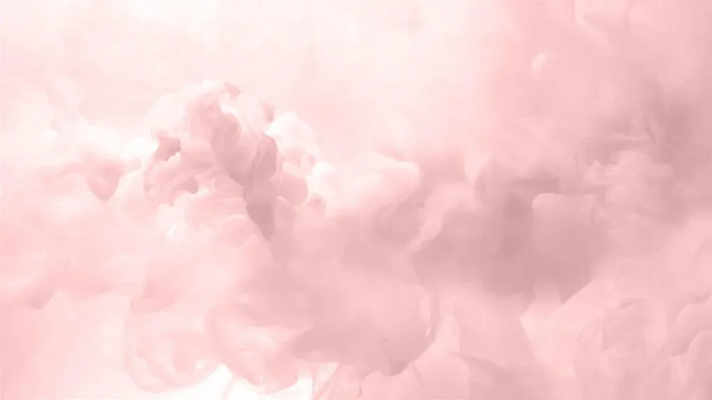 A Heavenly Delight: Gilded Rose amidst Aesthetic Pink Laptop Wallpaper & Clouds Background