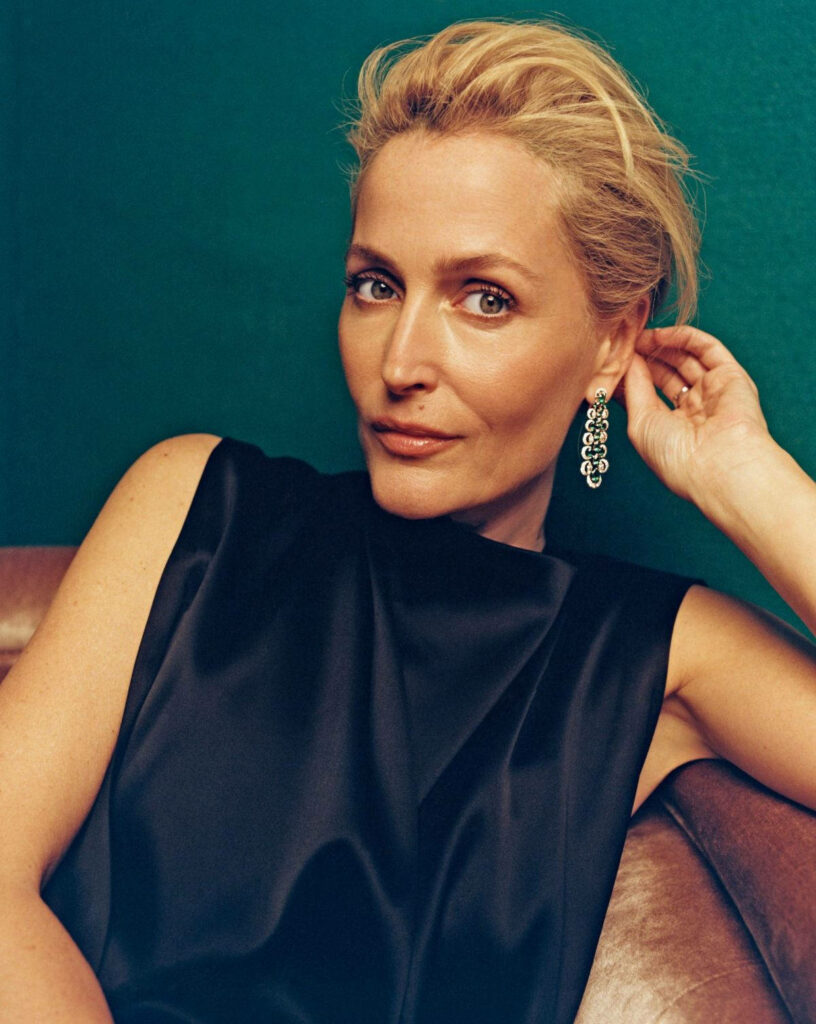 Gillian Anderson stylish black outfit green background In Style Magazine elegant portrait wallpaper