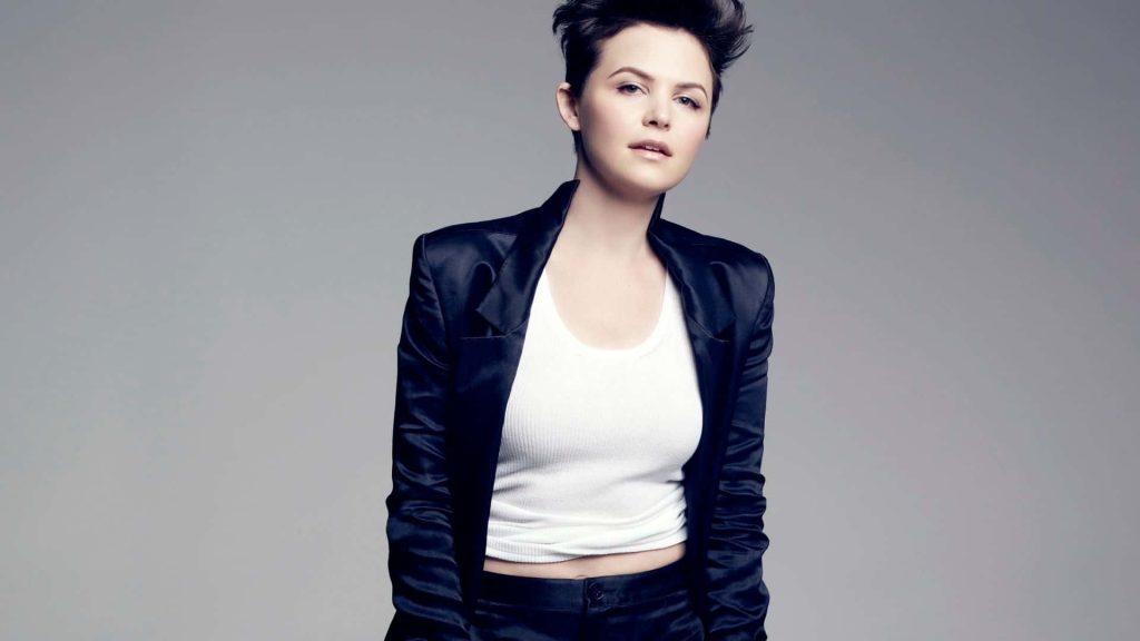 Ginnifer Goodwin studio portrait with short pixie haircut black blazer white tank top neutral background Wallpaper