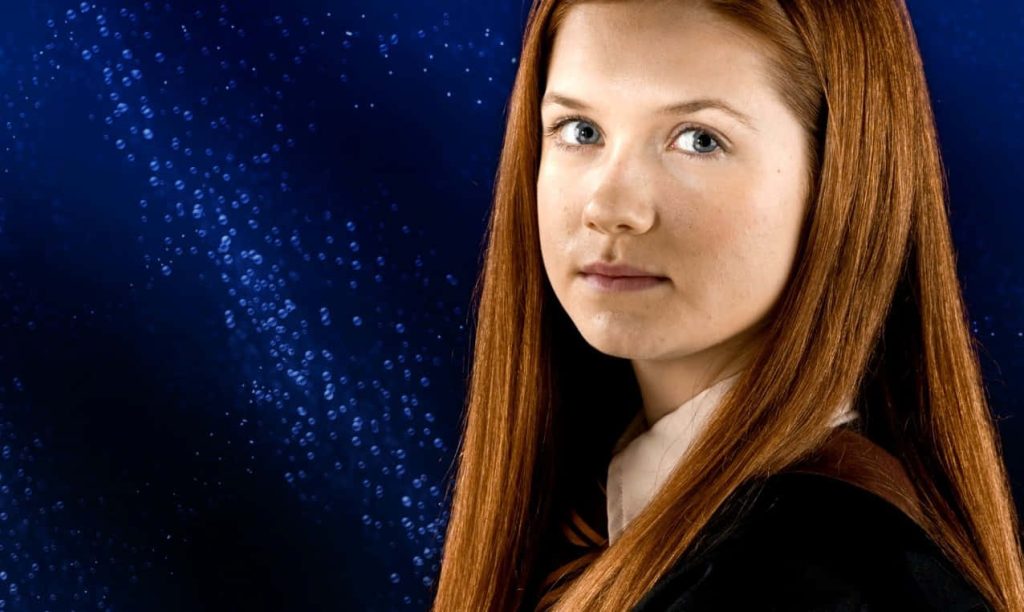 Bonnie Wright as Ginny Weasley Gryffindor portrait dark blue magical Harry Potter wallpaper