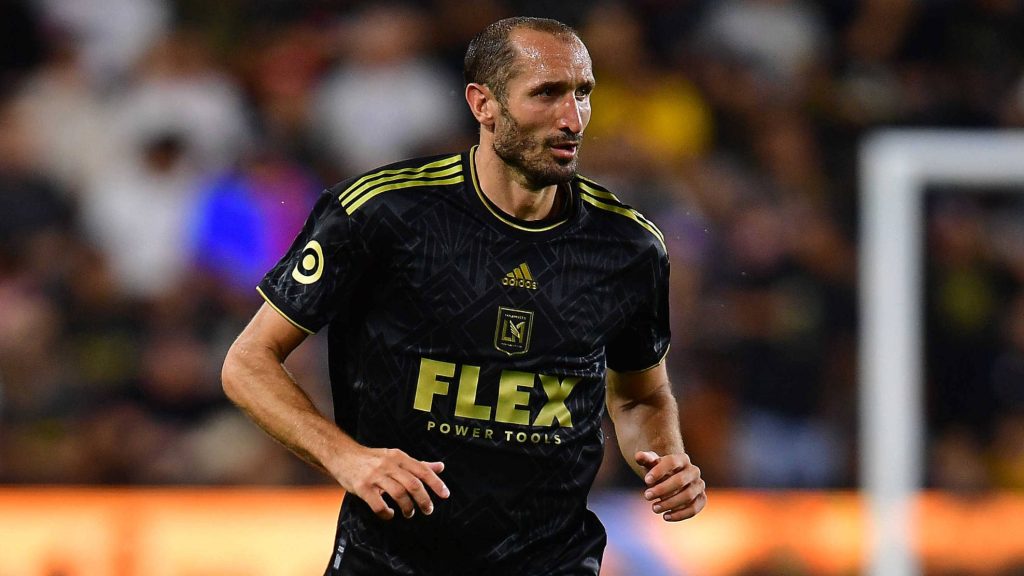 Giorgio Chiellini LAFC defender in black jersey intense action under bright stadium lights wallpaper