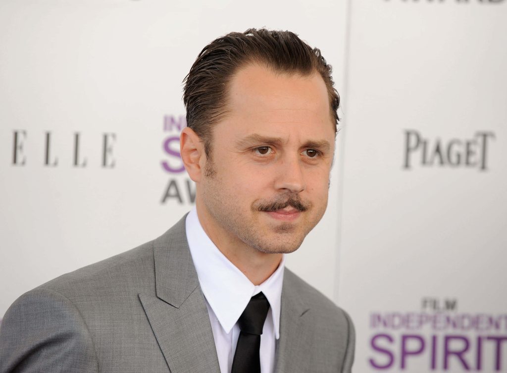 Giovanni Ribisi in grey suit and black tie on red carpet at Film Independent Spirit Awards event Wallpaper