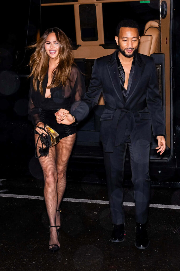 Chic Night Out: Glamorous Wallpaper of Chrissy Teigen & Partner