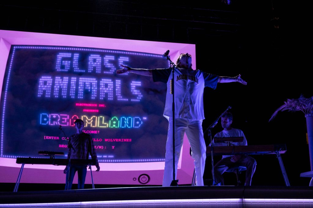 Glass Animals concert wallpaper Dave Bayley center stage neon purple Dreamland retro screen