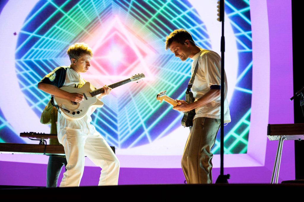 Glass Animals live concert with Dave Bayley Drew MacFarlane neon digital grid stage background Wallpaper