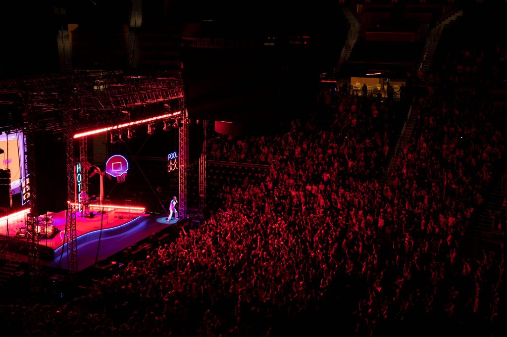 Glass Animals live concert at Crisler Arena red neon HOTEL POOL signs full crowd wallpaper background