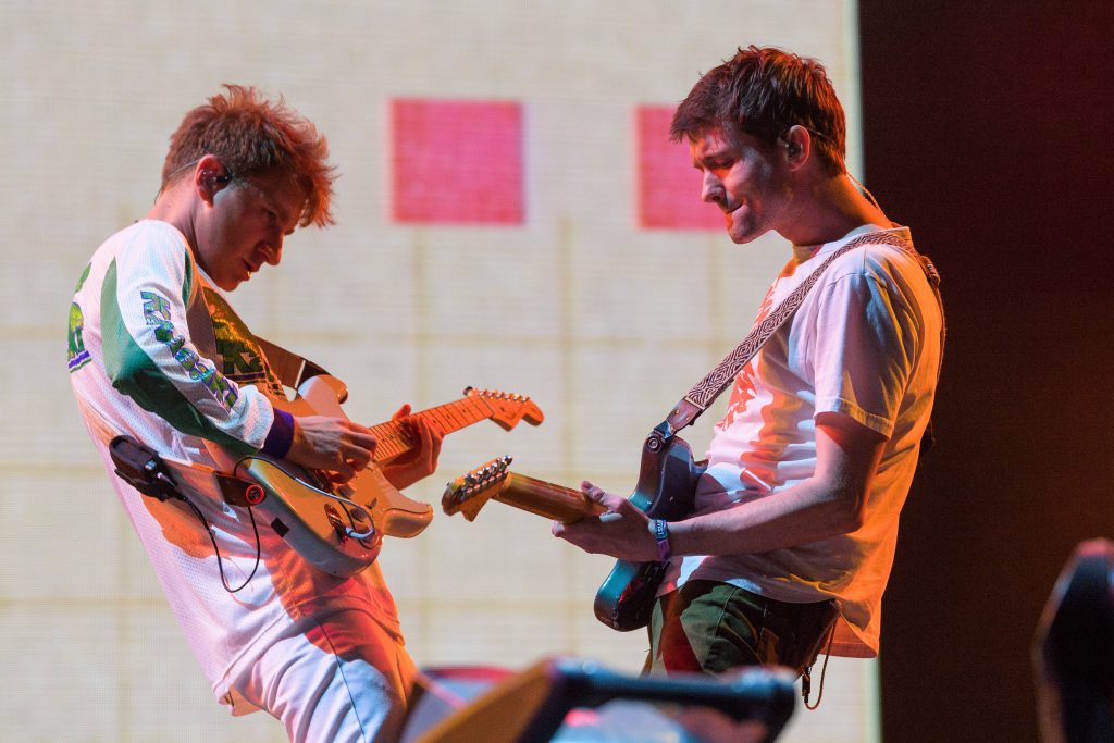 Glass Animals live concert wallpaper with Drew MacFarlane and Dave Bayley playing guitars