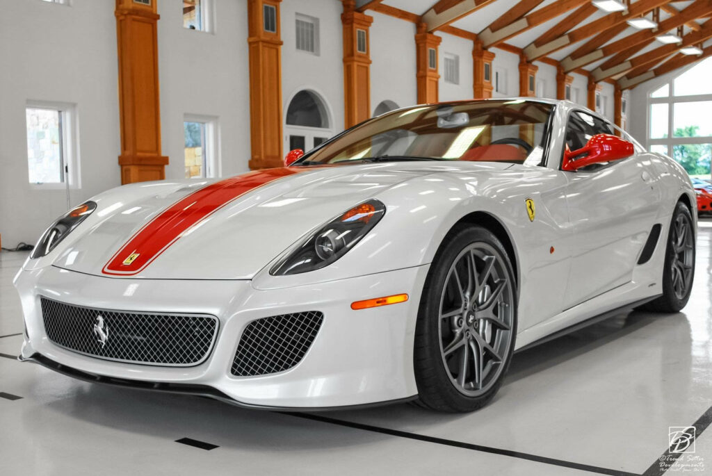 Captivating Capture of a Sleek White Ferrari with Striking Red Accent set against Luxurious Garage Backdrop Wallpaper