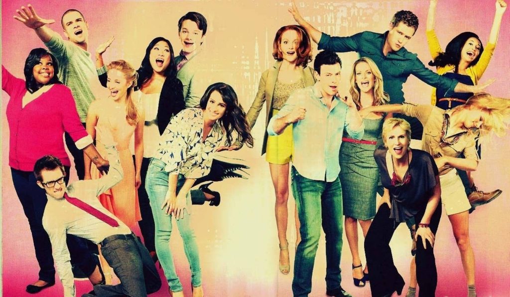Glee cast group photo with Lea Michele Cory Monteith Jane Lynch vibrant musical wallpaper background