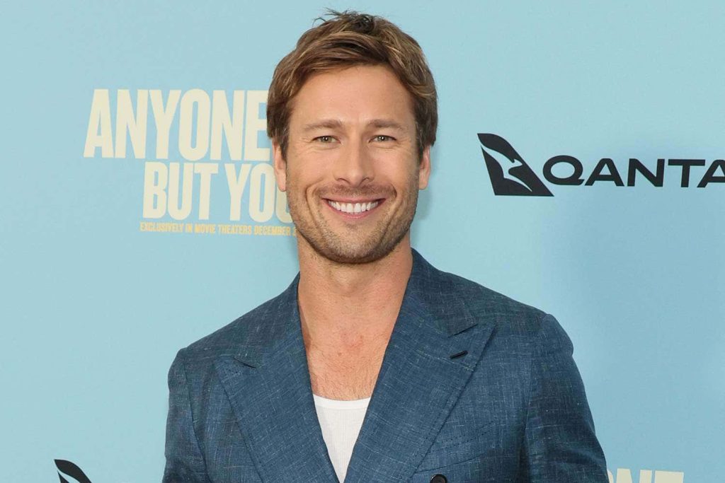 Glen Powell smiling in blue blazer at Anyone But You Qantas promo high-resolution portrait Wallpaper