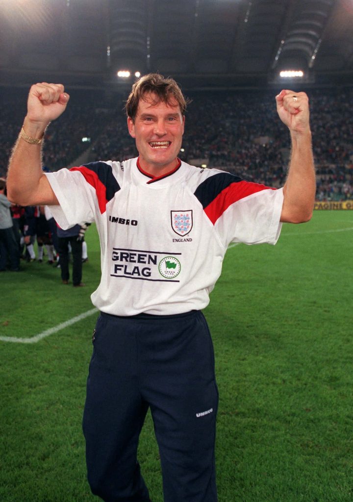 Glenn Hoddle celebrating on football pitch in England training kit dynamic sports wallpaper