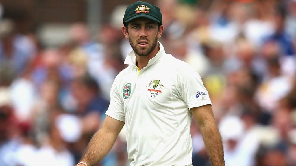 Glenn Maxwell in Australian cricket Test uniform and green baggy cap focused on field wallpaper