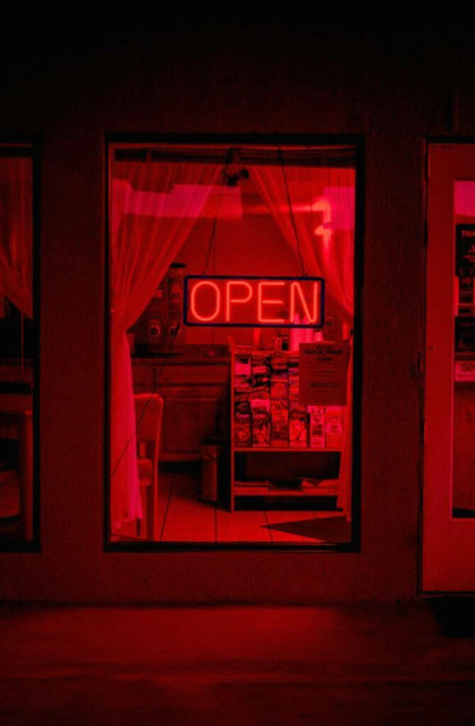 Mysterious Glow: Unveiling the Enigmatic Charms of a Store with Dark Red Illumination Wallpaper