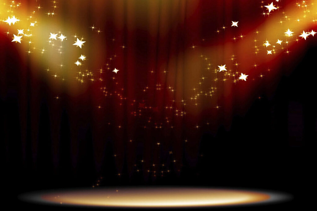 Glittering Performance: A Dark Stage Illuminated by Spotlights and Sparkles Wallpaper