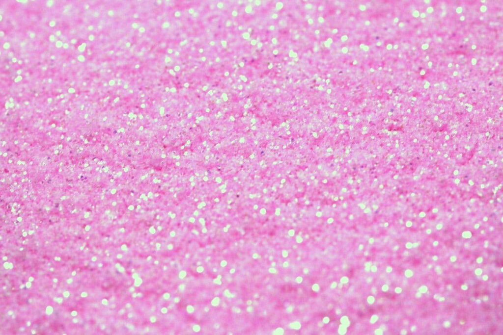 Vibrant Pink Glittery Texture Wallpaper for a Glamorous Backdrop